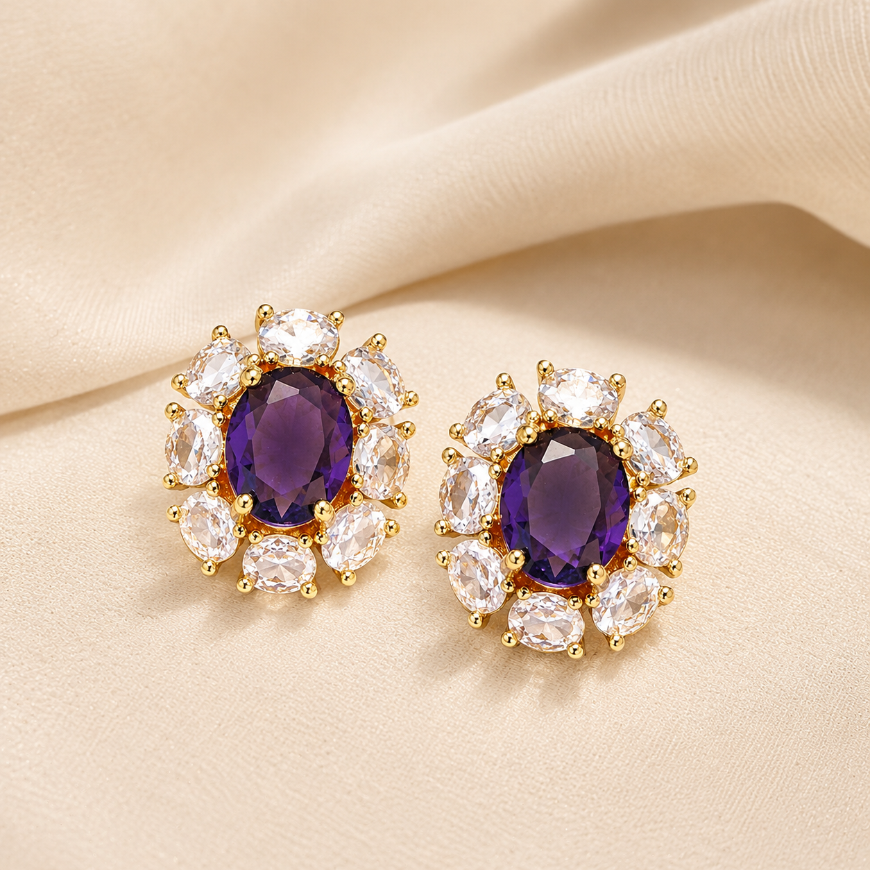 Luxury purple zircon halo earrings displayed on silk background