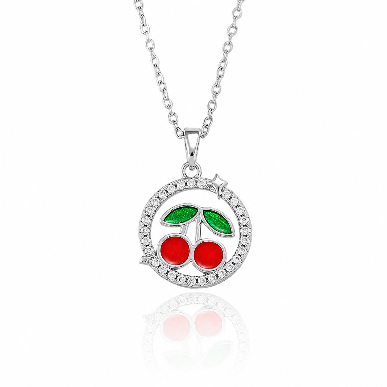 Silver-plated circular cherry pendant necklace with red and green enamel and a sparkling border