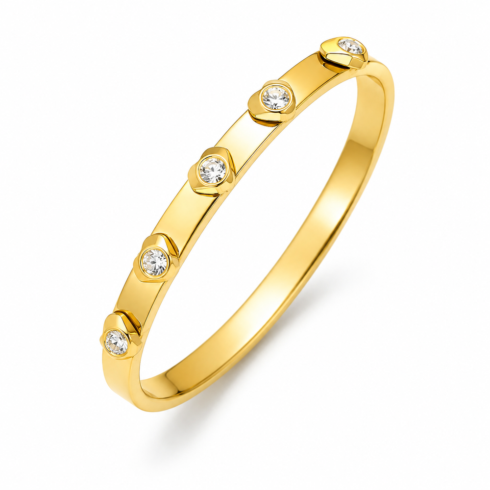 Zircon heart detail bangle with gold plated finish and sparkling stone accents